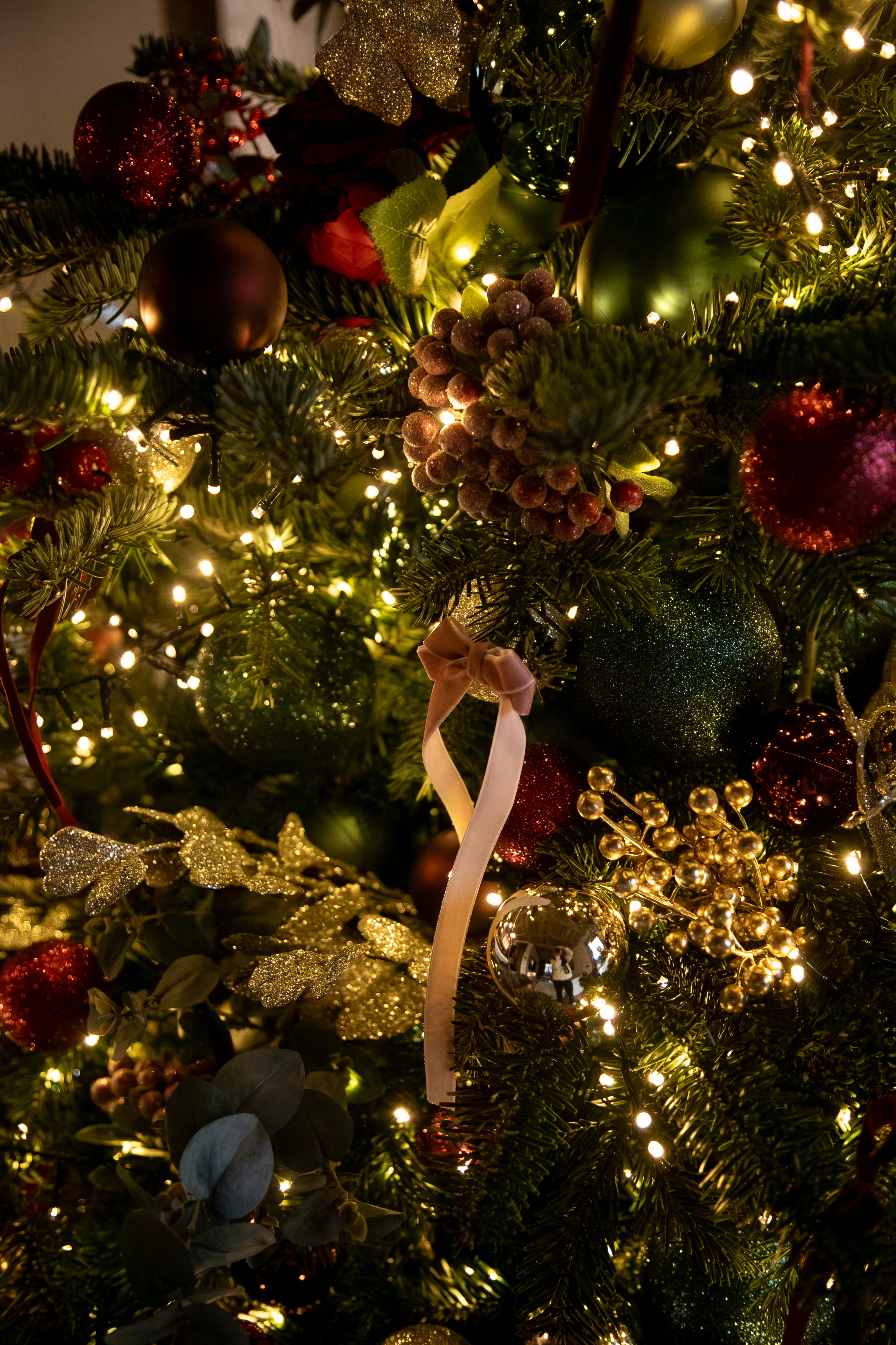 Preserved rose and eucalyptus detail in the tree