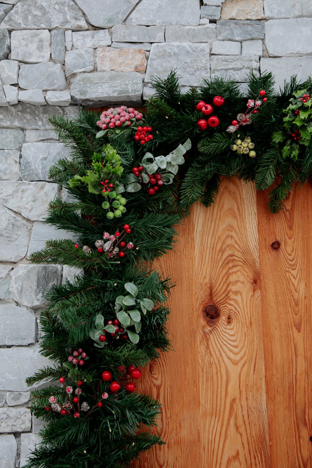 Garland over the stone and timber entrance
